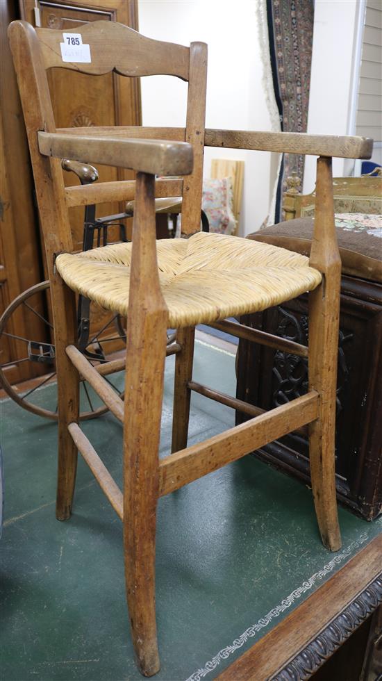 A Continental childs fruitwood high chair H.33in.